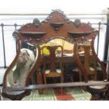 An Edwardian mahogany overmantel mirror with shaped outline and applied mouldings, enclosing four