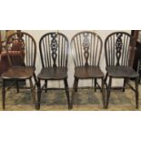 A set of four Windsor wheel back dining/kitchen chairs, with elm seats