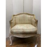 A 19th century French salon chair, the carved show wood framework with gilded finish with floral and