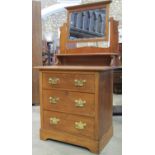 A stripped satin walnut dressing chest of three drawers with raised mirror back, together with an