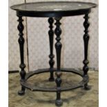 A small 19th century occasional table on two tiers united by four turned supports, of oval form with