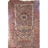 Good antique Turkoman rug with unusual architectural panelled decoration, upon a washed red