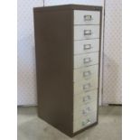 A Bisley steel nine drawer filing cabinet in brown and cream colourway, 28 cm wide x 41 cm deep x 86