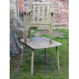 A small weathered teak garden table with slatted top, labelled to internal rail: 'Geebro products'