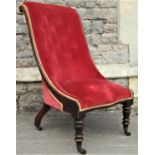 A Victorian drawing room chair with buttoned back, swept outline, raised on turned supports,