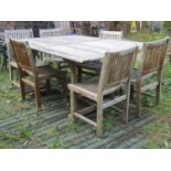 A Made On Earth weathered extending hardwood garden table of rectangular form with slatted top and
