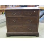 An Edwardian oak chest of two long and two short drawers, 107cm wide