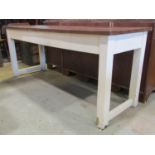 A teak wood and painted refectory table on square cut supports, with polished top and painted