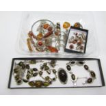 Varied collection of amber and green amber silver jewellery, to include several bracelets, pendants,