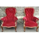 A carefully matched pair of Victorian drawing room chairs with carved and moulded show wood frames