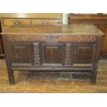 17th century oak coffer, the three panelled front within original repeating and carved detail,