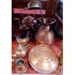 Collection of antique and later copper ware comprising four kettles, a caddy, a large jug, a ladle