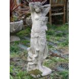 A small reclaimed garden ornament in the form of gypsy girl/exotic dancer, 66 cm high