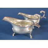 Pair of 1930s Georgian style silver sauce boats with acanthus scrolled handles and hoof feet,