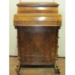 A Victorian figured walnut piano top davenport with four real and four dummy drawers, the folding