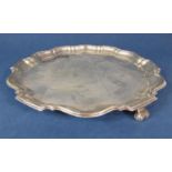 1930s Georgian style silver salver with raised piecrust borders and scrolled feet, maker marks worn,