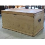 A stripped and waxed pine blanket chest with steel handle, 95cm wide