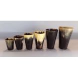 Six graduated, turned and polished cow horn beakers