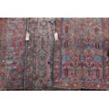 Three similar antique Heriz rugs, all with similar decoration, each 180 x 100cm approx (3)