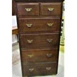 An Edwardian mahogany tower of four long and two short graduated drawers, set of a plinth base