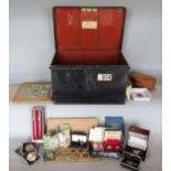 A tin deed box fitted with a collection of interesting items to include a solitaire board, a cased