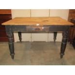 A Victorian pine scrubbed top kitchen table with frieze drawer on turned supports, 120cm x 80cm