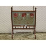 Early 20th century mahogany firescreen, the central panel with art nouveau hand embroidered