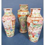 A pair of 19th century Famille Rose vases of shouldered form with painted decoration of garden
