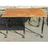 A low garden/interior occasional table with rectangular teak top raised on six painted and weathered