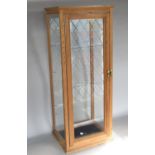 Good quality pitch pine table top glazed display cabinet, with hinged door and glass shelves, 77cm