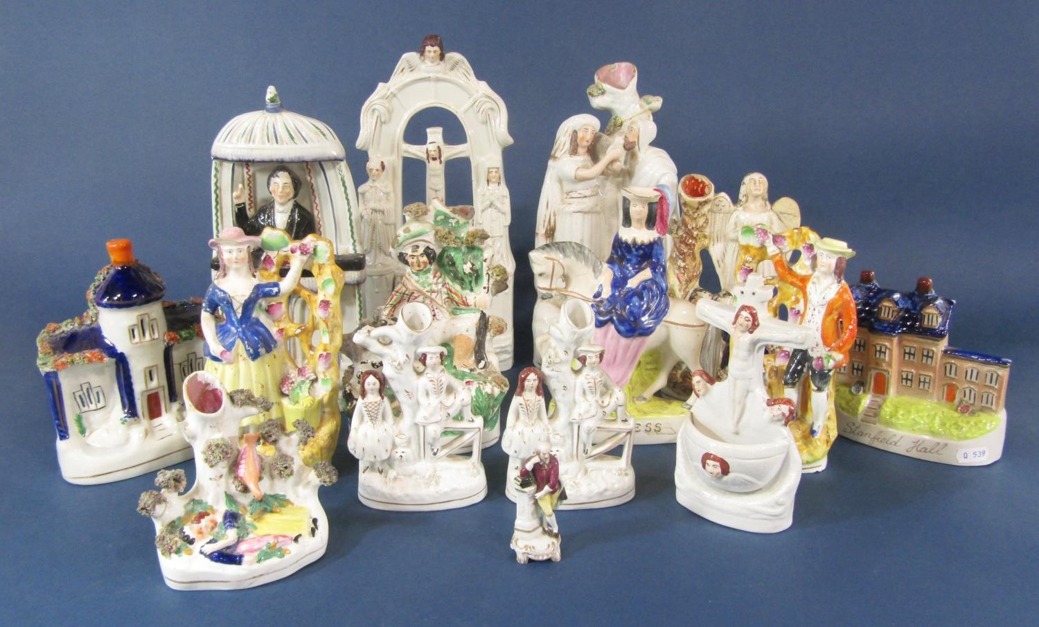 A 19th century Staffordshire figure of C H Spurgeon preaching from a pulpit, moulded title to
