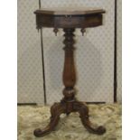 A Victorian rosewood occasional table of octagonal form with rising lid, revealing a shallow