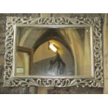 An antique style wall mirror of rectangular form with bevelled edge plate within a silver coloured