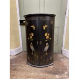 A Georgian oak bow fronted hanging corner cupboard with later or revived chinoiserie detail, 93cm