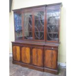 A good quality Georgian style mahogany breakfront bookcase, the lower section enclosed by four
