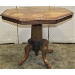 A Victorian octagonal occasional table with floral marquetry inlaid detail, raised on a tapering