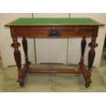 A walnut hall table with baise lined top, fitted with two slender side frieze drawers, raised on