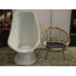 A wicker chair raised on a cone shaped base with painted finish and a further 1960s cane chair