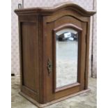 A small oak wall or bathroom cabinet with bevelled edge mirror plate to the door, 50cm high x 40cm