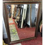 A contemporary wall mirror in the antique style with mahogany moulded framework and gilded repeating