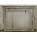 A partialy stripped 19th century pine mirror or picture frame with moulded surround 120cm x 98cm