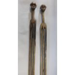 Tribal interest - Pair of unusually tall tribal fertility figures, modelled as a male and female,