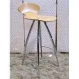 A modern laminated bar stool on a chrome frame