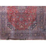 Large Hamadan type country house carpet with typical central blue medallion framed by further