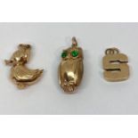 Three 9ct charms; a duck, an owl and an 'S', 8.5g total (3)