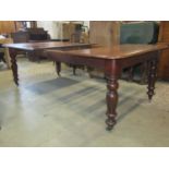 A Victorian mahogany extending dining table with a single additional leaf, on turned supports, 170cm