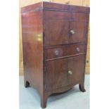 A Georgian mahogany foldover top wash stand, with enclosed front on turned supports, 52cm wide