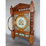 Arts & Crafts oak cased mantle clock fitted with various Iznik type tiles flanked by turned