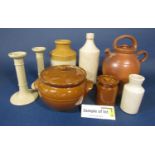 An extensive collection of stoneware useful wares including crocks and covers, bottles, pair of
