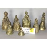 A large collection of cast brass figural hand bells, mainly ladies in traditional period dress, also